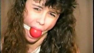 18 YR OLD LATINA CUTIE IS BAREFOOT, TIED TO STOOL, TIT-TIED, CROTCH-ROPED, HANDGAGGED & BALL-GAGGED (D47-1)