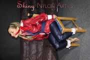 Sexy Sandra wearing sexy red/blue rainwear being tied and gagged with ropes and a clothgag on a chair (Pics)