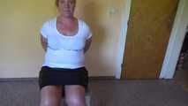 Cuffed on a chair 001