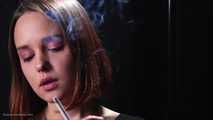Dasha is smoking in the studio