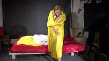 Sandra preparing her shiny nylon bed wearing sexy shiny nylon shorts and a top (Video)