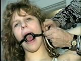 19 Yr OLD SINGLE MOM RONI IS HOME MADE RING GAGGED, HANDS TIED BEHIND HER HEAD & TIED UP SITTING BACKWARDS TO A CHAIR (D50-10)