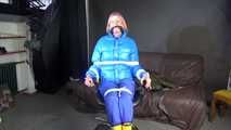 Sexy Pia being tied and gagged with ropes and a cloth gag on a hairdressers chair wearing a sexy blue shiny nylon rainpants and a lightblue downjacket (Video)