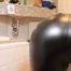 Frida cleaning the bathroom in her white shirt and black glossy leggins