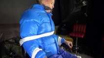 Sexy Pia being tied and gagged with ropes and a cloth gag on a hairdressers chair wearing a sexy blue shiny nylon rainpants and a lightblue downjacket (Video)