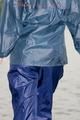 Sexy archive girl wearing a blue rain pant and rain jacket walking on a lake in freetime (Pics)