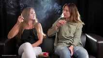 Two friends are smoking sitting on the sofa in this smoking fetish video