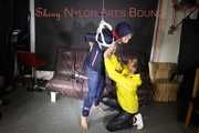 Sandra beeing tied and gagged by Stella in Shiny Nylon Rainwear crotchrope-suspended 