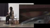 Mistress Cleo squirts cologne into the mouth of the slave lying in the toilet. Picture in Picture