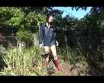 Mara wearing only a hot rain jacket and rubber boots lingering in the garden taking a shower (Video)