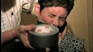 47 Yr OLD UNCOOPERATIVE BRAT LATINA HAIR DRESSER IS WRAP TAPE GAGGED, WIDE EYED GAG TALKING, BOUND UP WITH DUCT TAPE AND BAREFOOT (D59-11)