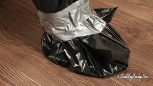 [From archive] Canella - Hogtaped in trash bags and cling film 01