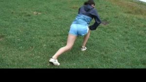 Enni during stretching wearing shiny nylon shorts and an oldschool rain jacket (Video)