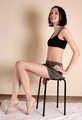 Emily bound with rope, sittin on the stool