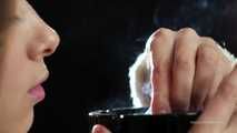 A young lady showing her smoking skills in a closeup video 
