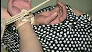 38 Yr OLD CASHIER HAS MOUTH STUFFED WITH STINKY NYLON STOCKINGS, CLEAVE GAGGED, BAREFOOT & HOG-TIED ON TABLE (D52-1)