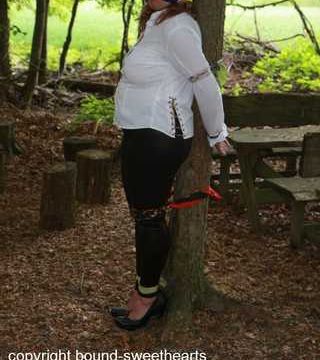Soraya toweltied to a tree PICS