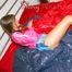 Alina preparing her bed for relaxing and lolling on the bed wearing sexy shiny nylon shorts and a rain jacket (Pics)