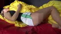 Sandra preparing her shiny nylon bed wearing sexy shiny nylon shorts and a top (Video)