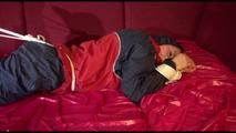 Lucy tied, gagged and hooded on a sofa wearing an oldschool rainwear combination (Video)