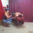 Cassandra, sitting and tickling