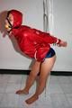 Alina tied and gagged in shiny nylon shorts and a shiny nylon cagoule