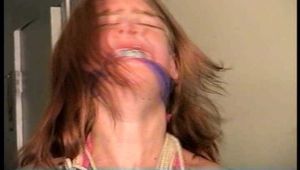 24 Yr OLD CRAFTER IS  CLEAVE GAGGED, TIES HERSELF WITH TAPE, STUFFS HER OWN MOUTH, TAPE GAGS HERSELF, HANDCUFFS HERSELF, IS HANDGAGGED WHILE WEARING A SEXY BIKINI (D73-4)