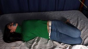 Roxana hogtied on bed