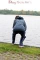 Sexy archive girl wearing a blue rain pant and rain jacket walking on a lake in freetime (Pics)