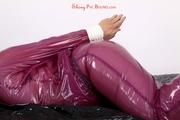 Sophie in an shiny transparent purple PVC suit tied and gagged in bed (Pics)