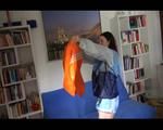 Jill folding shiny nylon clothes wearing shiny nylon clothes (Video) 