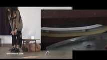 Mistress Cleo squirts cologne into the mouth of the slave lying in the toilet. Picture in Picture