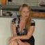 Benita opens her blouse and lifting her skirt in front of the kitchen