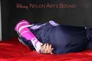Watching Pia wearing blue/pink shiny nylon rainwear being tied and gagged and hooded with tape and a clothgag (Pics)