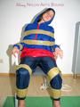 Katharina tied by using tape, gagged and hooded on a chair wearing sexy red/blue rainwear (Pics)
