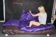 Watching Pia preparing her bed wearing a sexy black shiny nylon shorts and a grey tshirt (Pics)