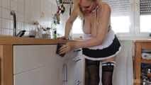 Busty blonde maid Cara cleans the kitchen