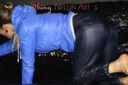 Sexy Sandra wearing a supersexy black shiny nylon rain pants and a sexy shiny blue rain jacket lolling on the sofa (Pics)