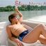 Stella and Leonie on a boat wearing sexy shiny nylon shorts and bikini tops (Pics)