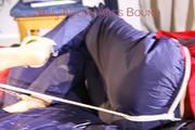 Sonja tied, gagged and hooded on bed with cuffs, chains and a gag wearing a sexy blue shiny nylon rain pants and a red rain jacket (Pics)