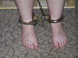Sandra cuffed and roped