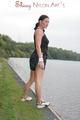 Enni outdoor wearing a sexy black shiny nylon shorts and a black top (Pics)