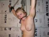 Dumb Blonde Slut is Tied and Stripped Naked in the Garage, Exposed in humiliating nude bondage.