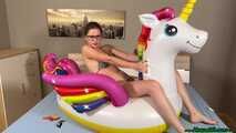 nail2pop promotional balloons on inflatable unicorn and destroying it with a pen