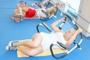 Jenny and Katharina in the fitness studio wearing sexy shiny nylon shorts and tops (Pics)