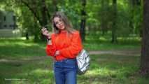 Pretty Kate is smoking Marlboro Red 100s in the park