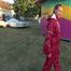 Watch Sandra taking a Walk during very hot Weather enjoying her rubberized oldschool Rainsuit