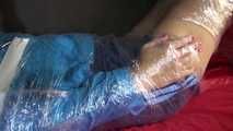 Watching sexy Pia being envelopped in film wearing a sexy blue shiny nylon shorts and a lightblue shiny nylon rainjacket (Video)