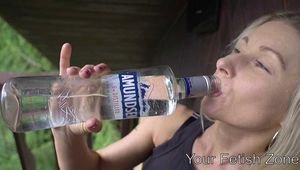Vanessa is drinking in a hut