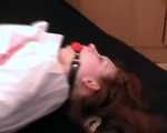 Barefoot nurse Gatitta tied up with a red rope (video)